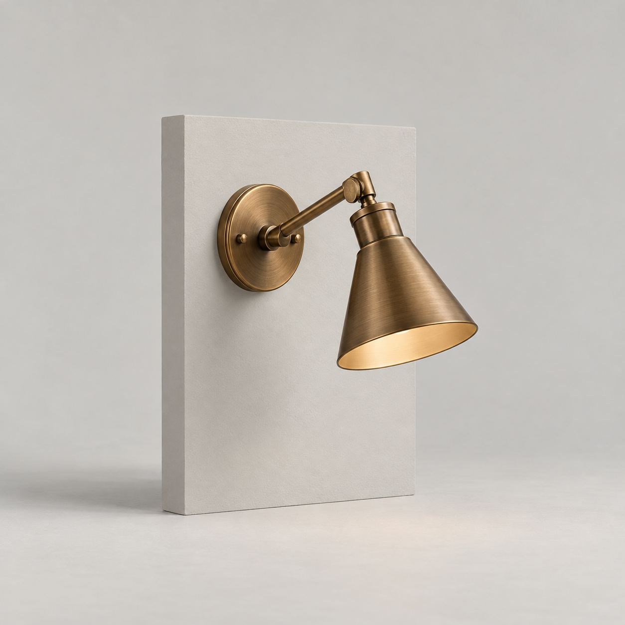 Arco Bronze Wall Light on a pale studio background