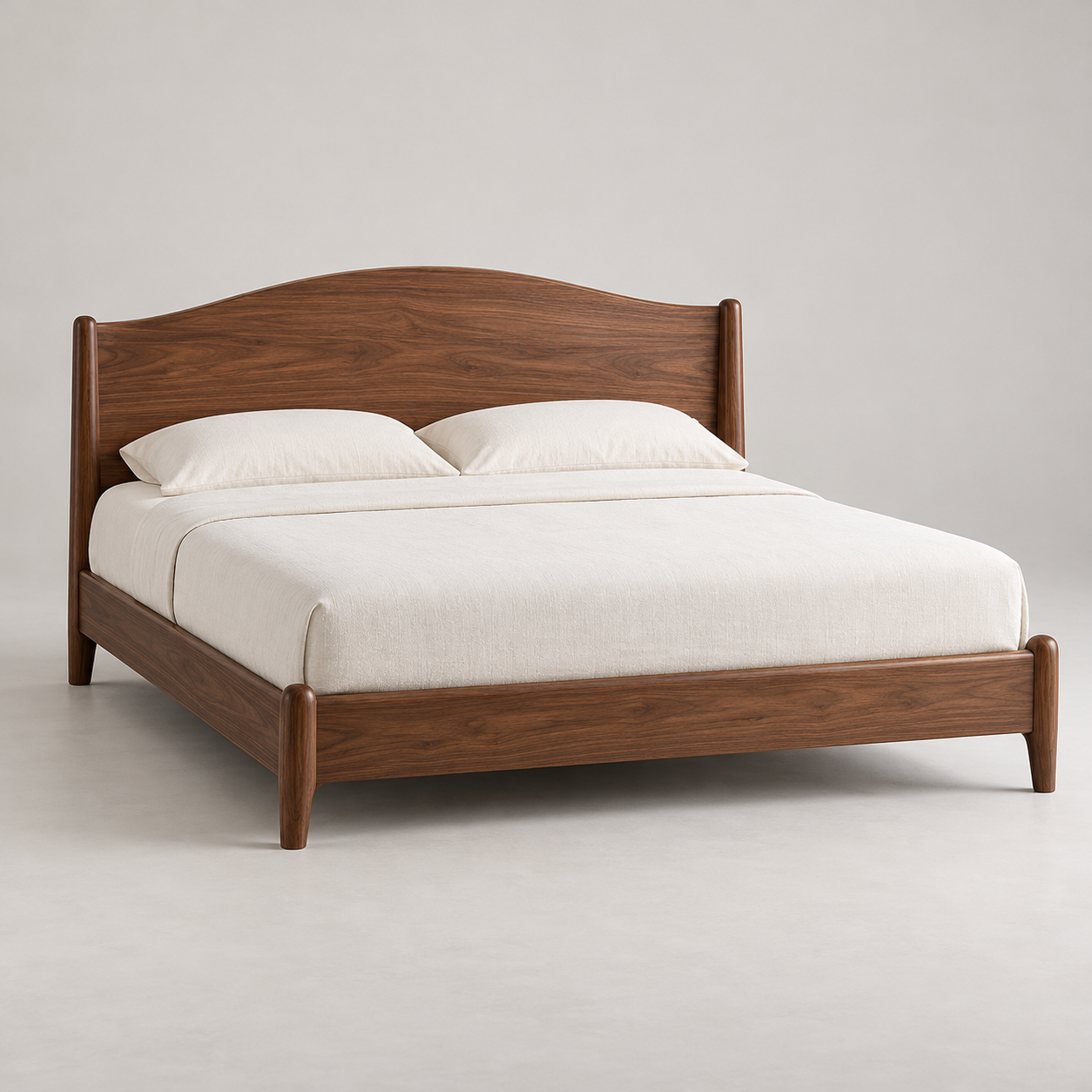 Dalia Walnut Bed on a pale studio background