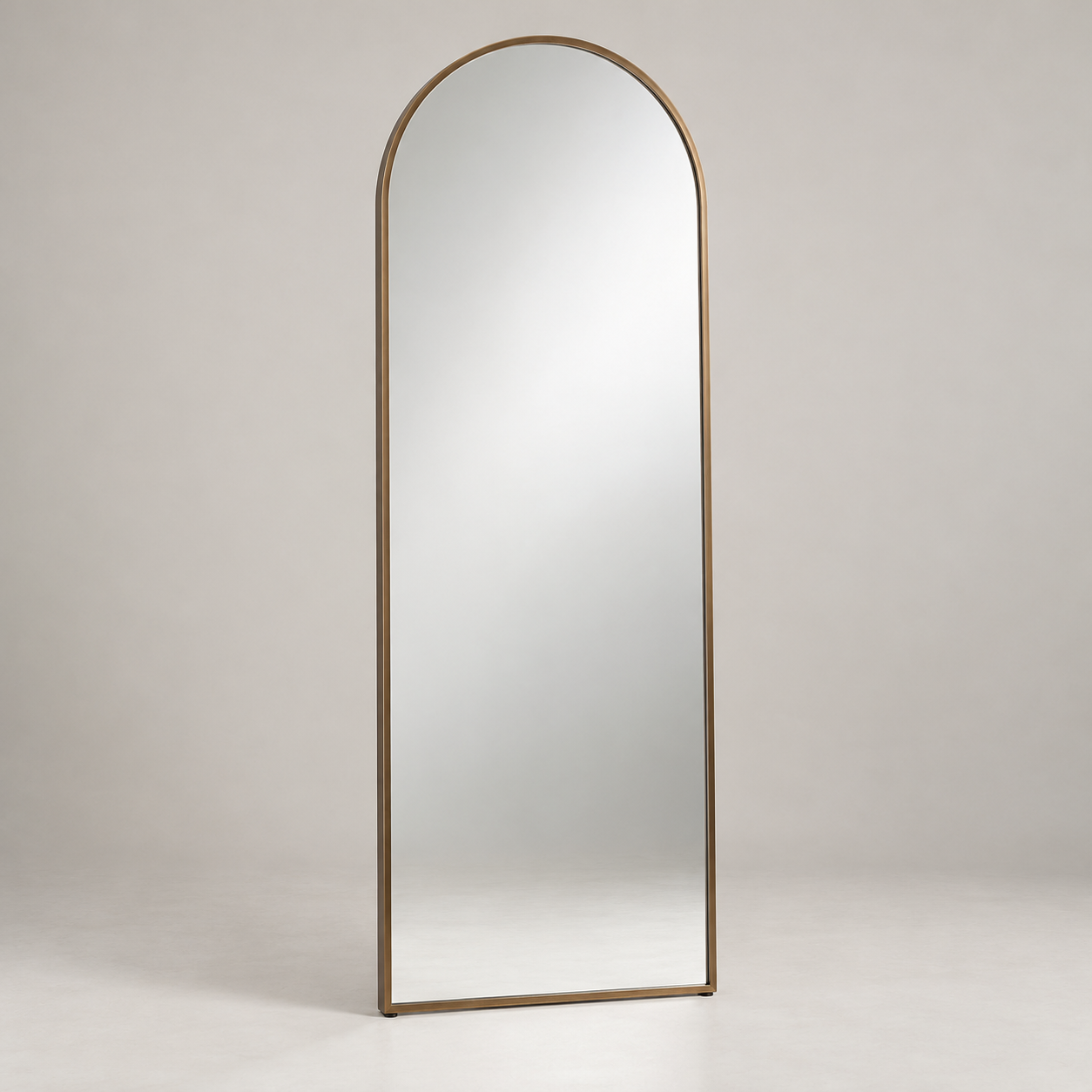 Espejo Arched Mirror on a pale studio background