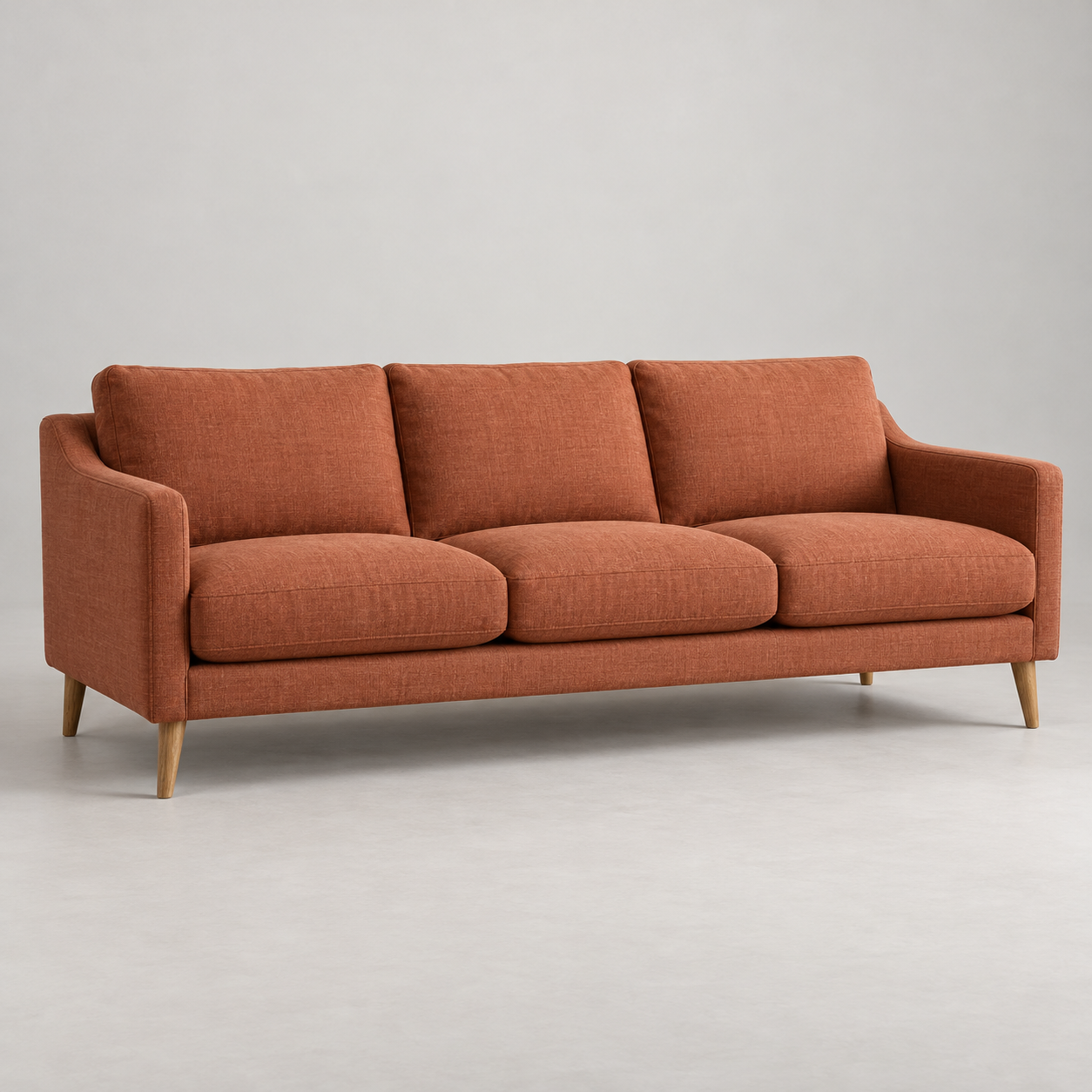 Onda Terracotta Sofa on a pale studio background